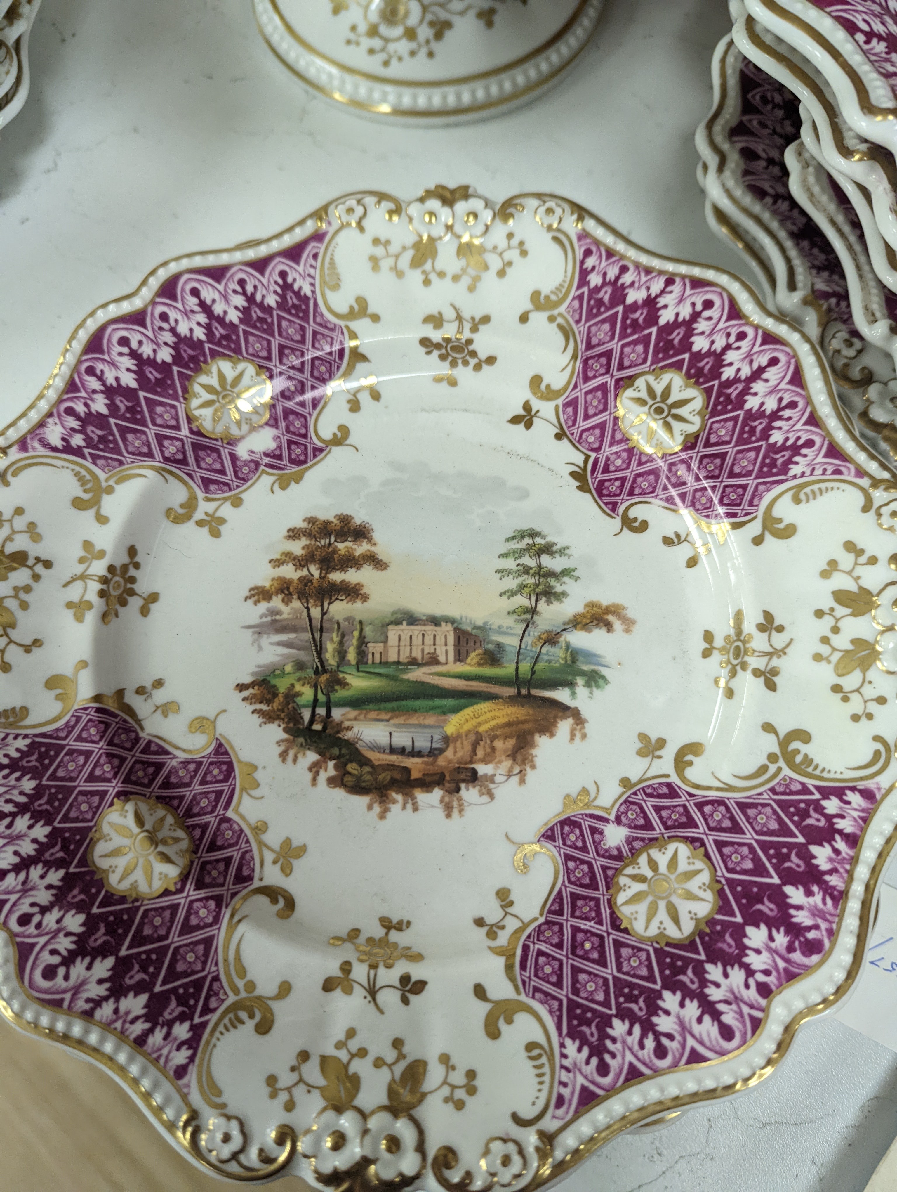 A Ridgways porcelain topographical part dessert service, c.1835, pattern number 2168, the sauce tureens and covers pattern number 2179